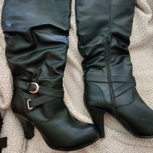 Black knee high heeled boots